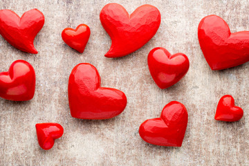 Red heart on the wooden background.