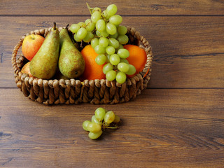 Fruit basket on a wooden surface.