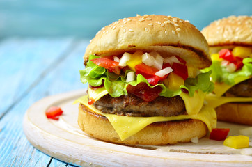 Homemade burger with meat cutlet,cheese and sweet pepper.