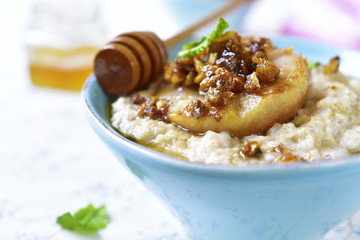 Oat porridge with caramelized pear and walnuts.