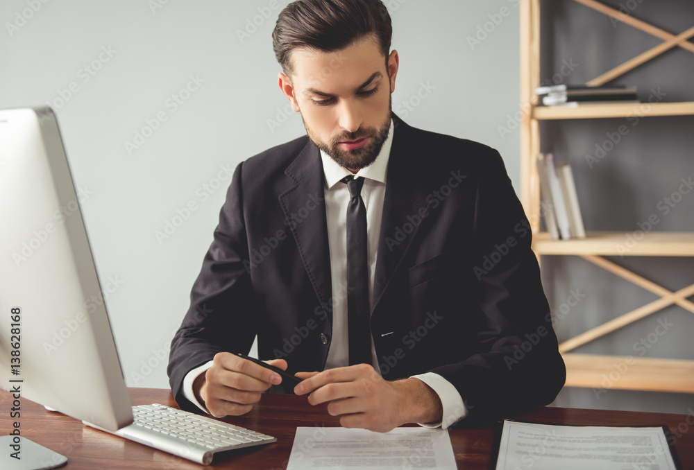 Wall mural Handsome young businessman