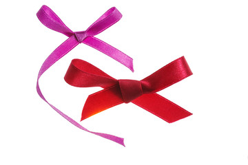 Red and purple gift bows isolated on white background
