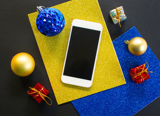 Christmas tree ornament and smartphone flat composition