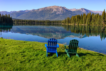 Two Adirondack chairs