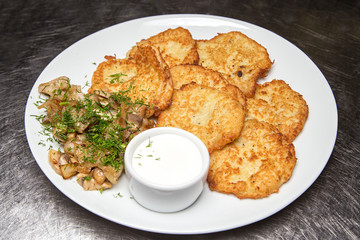 potato pancakes with sour cream