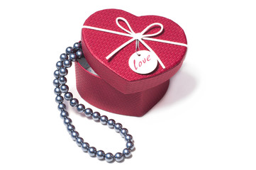 Black pearls in a gift Valentine's Day in box in the form of heart