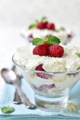 Traditional english dessert eton mess with fresh raspberry.