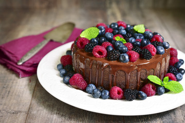 Chocolate cake with fresh forest berries.