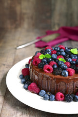 Chocolate cake with fresh forest berries.