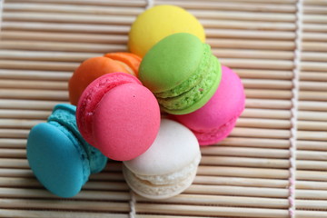 Mini Macarons on bamboo mat  colorful deserts