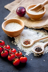 ingredients for paella on dark background