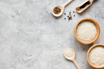 rice for paella on stone background top view mock up