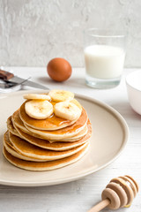 cooked pancake on plate at wooden background