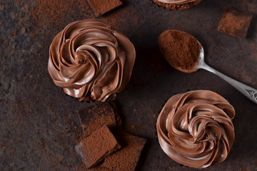 Chocolate cupcakes with peanut paste the old grunge background