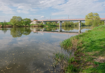 May spring landscape with the river and the bridge. River Osetr in the vicinity of the town Zaraysk in Moscow region