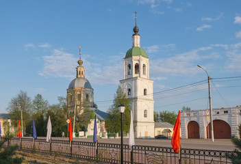 Russian town Zaraysk in the Moscow region. Trinity Church and Arcade shopping malls sunny May evening