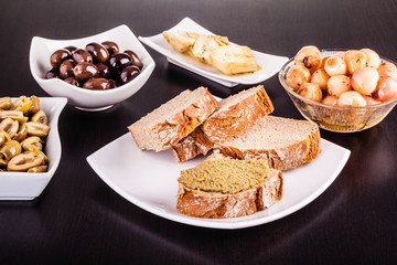 Italian appetizers on black