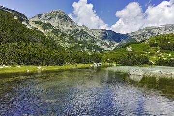 Naklejka na ściany i meble Landscape with Reflection of Muratov peak in river, Pirin Mountain, Bulgaria