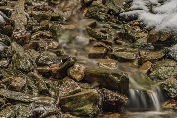 Fototapeta na wymiar Ice frosty winter creek on Jested hill