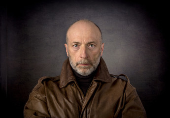 headshot of man in leather jacket