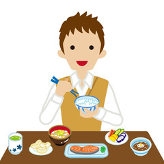 和食の朝食を食べる男子高校生　長袖