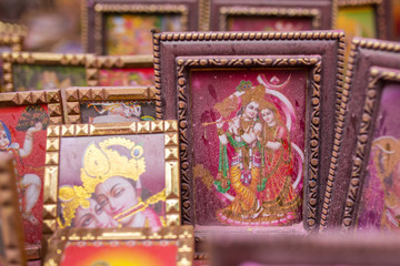 Fototapeta na wymiar Krishna picture covered by colorful powder during Holi celebration in India