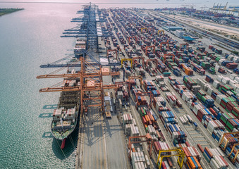 The busy of port congestion loading and discharging  containers services in maritime transports in World wide logistics - obrazy, fototapety, plakaty