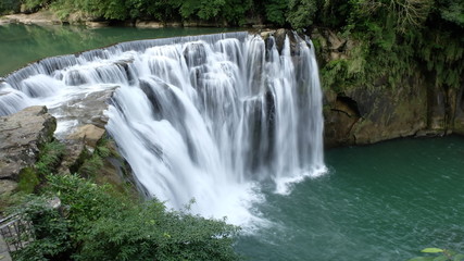 Shifen Waterfall, a scenic waterfall located in Pingxi District, New Taipei City, Taiwan, on the upper reaches of the Keelung River.