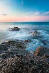 Waves and rocks shore long exposure