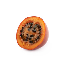 Half of a ripe tamarillo fruit isolated