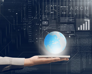 Businessman holding mobile phone in his hand with globe on it