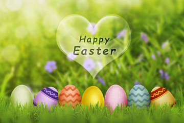 Colorful Easter eggs with fresh green grass