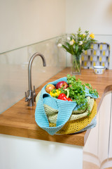 Fruits and Vegetables in Crocheted Bag on Kitchen Counter