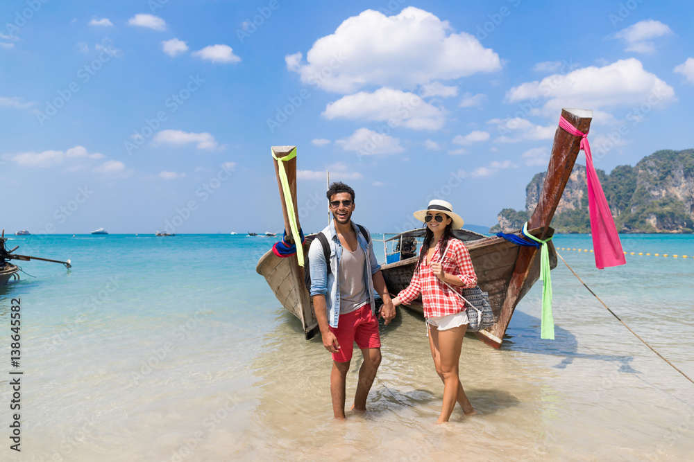 Wall mural young couple tourist long tail thailand boat ocean sea vacation travel trip tropical holiday