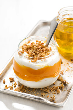 Dessert With Pumpkin, Honey, Cream And Cookies