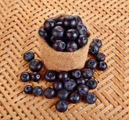 Fresh sweet blueberry fruit. Dessert healthy food. Group of ripe blue juisy organic berries. Raw summer diet. Delicious nature vegetarian ingredient. Wooden background