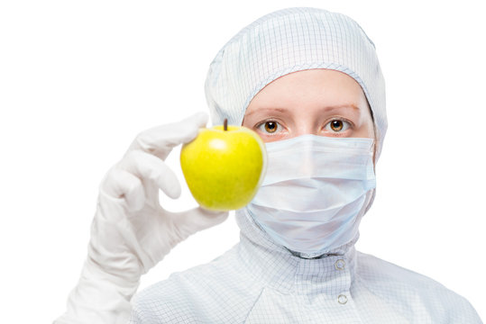 Biologist in a protective suit and a good healthy apple isolated