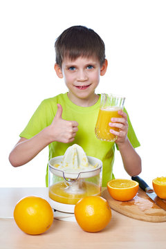 Happy boy with juice and showing thumbs up isolated