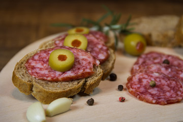 Sandwiches with salami and olives