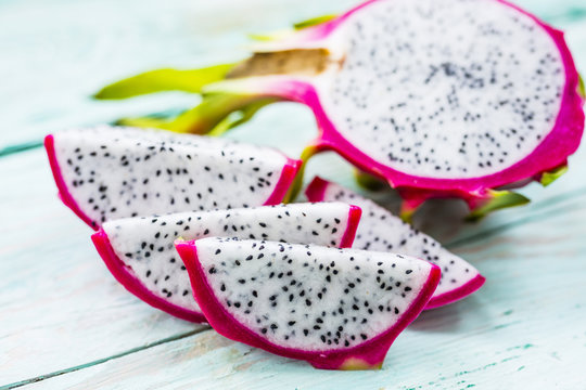 Dragon fruit, pitaja exotic fruit on wooden background. 