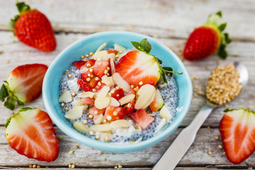 Strawberries and chia seeds grains quinoa and yogurt. Healthy and delicious super diet. 