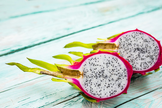 Dragon fruit, pitaja exotic fruit on wooden background. 