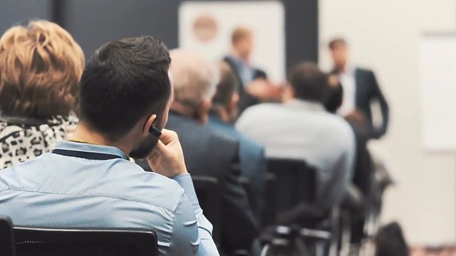 Students on training of Information Technology. IT conference for Young Programmers. Studying management of companies. Development of new applications and teamwork. Person from financial organization