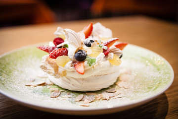 Pavlova, a home made cake from layers of meringue