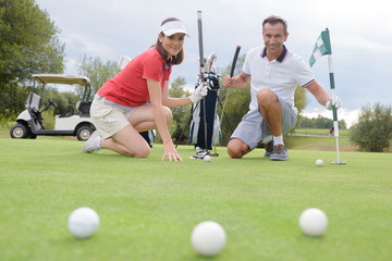 golfers and balls