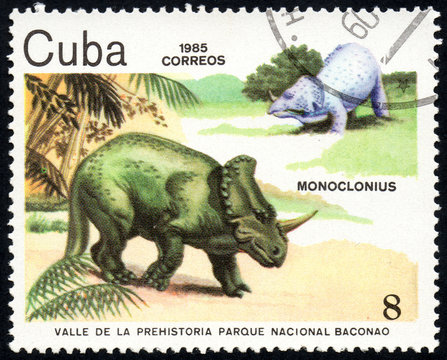 UKRAINE - CIRCA 2017: A stamp printed in Cuba, shows a extinct animals Monoclonius from the park of dinosaurs in the reserve Baconao, the series Valle de la prehistoria parque nac. Baconao, circa 1987