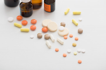 Composition of medicine bottles and pills  on white background