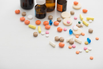 Composition of medicine bottles and pills  on white background