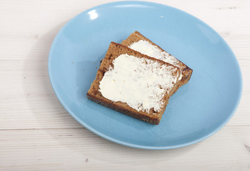 Traditional Dutch cake Ontbijtkoek with traditional butter on wooden background