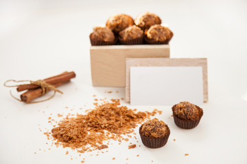 Tasty sweets in the wooden box, visiting card and cinnamon